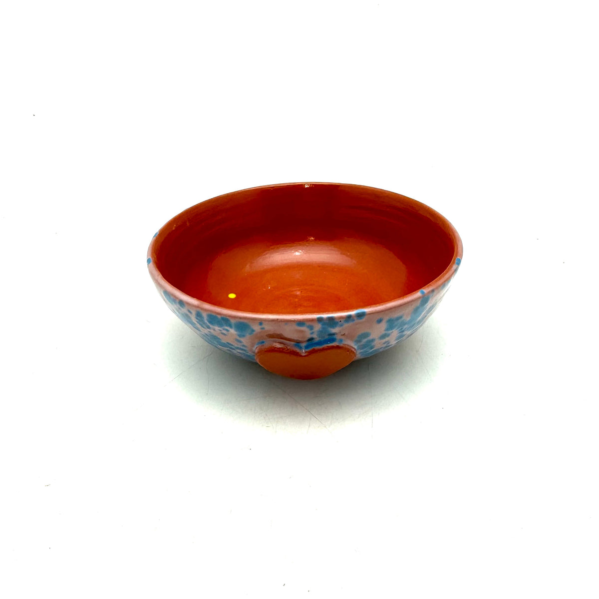Heart ice-cream bowl with blue speckled sides and red interior, red heart detail front