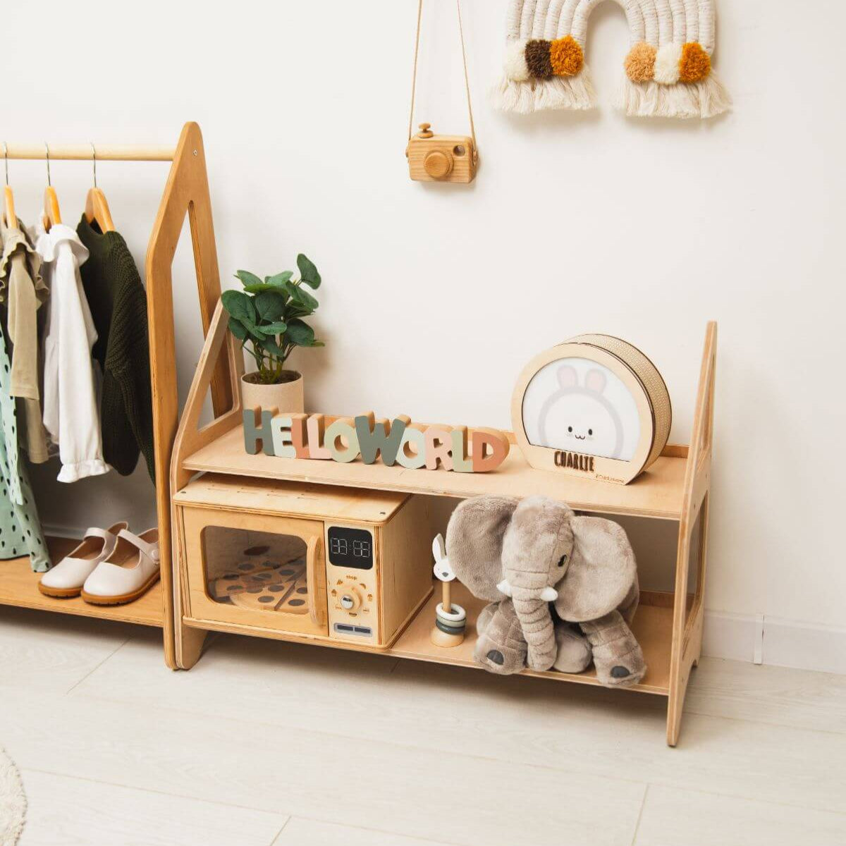 Light wood children’s storage bench organizer with lower cabinets and open shelves