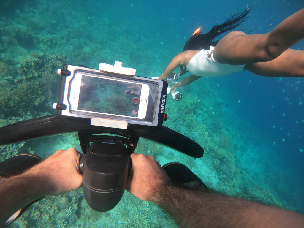White waterproof drone with handle, phone screen mount, and front dual fans