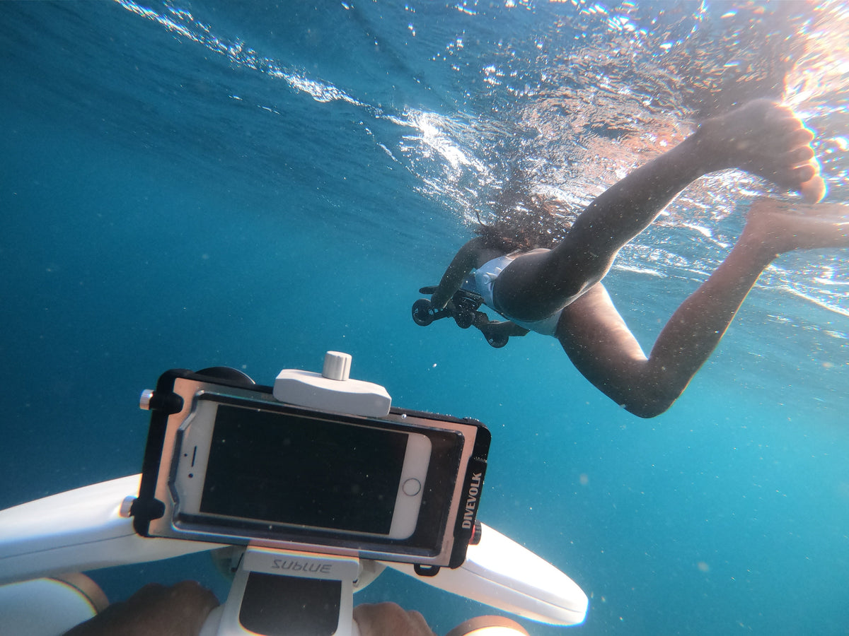White underwater drone with phone screen mount and two side fan openings