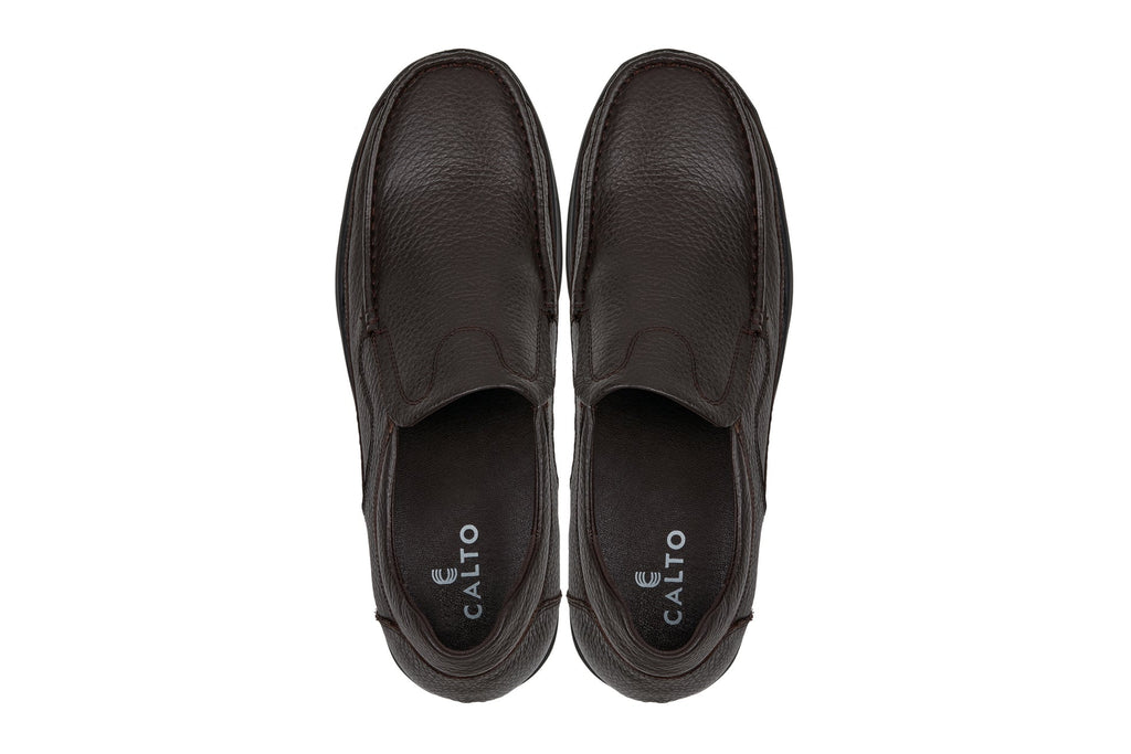 Pair of dark brown slip-on loafers with CALTO logo on the heel lining