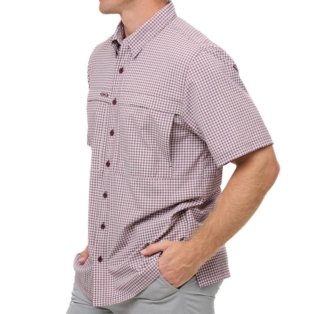 Maroon check short-sleeve button-up shirt with chest pocket and shirttail hem.