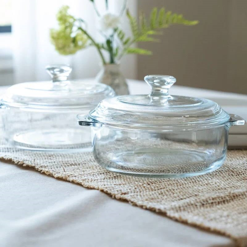 Clear glass Dutch oven with domed lid and loop handles for baking