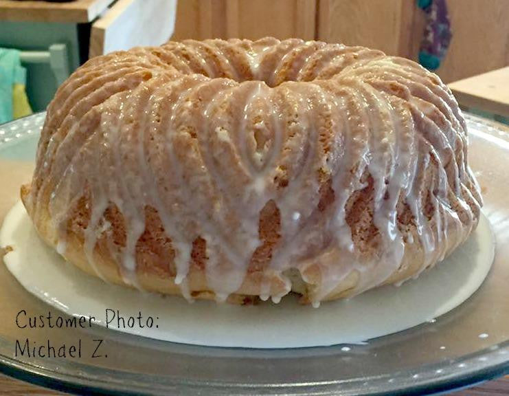 Gluten-free flour bundt cake with white icing drizzled over the ridged top