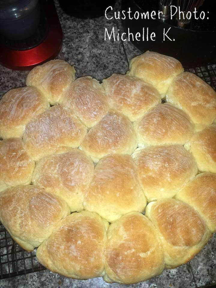 Gluten-free flour braided bread loaf on a baking tray with golden crust