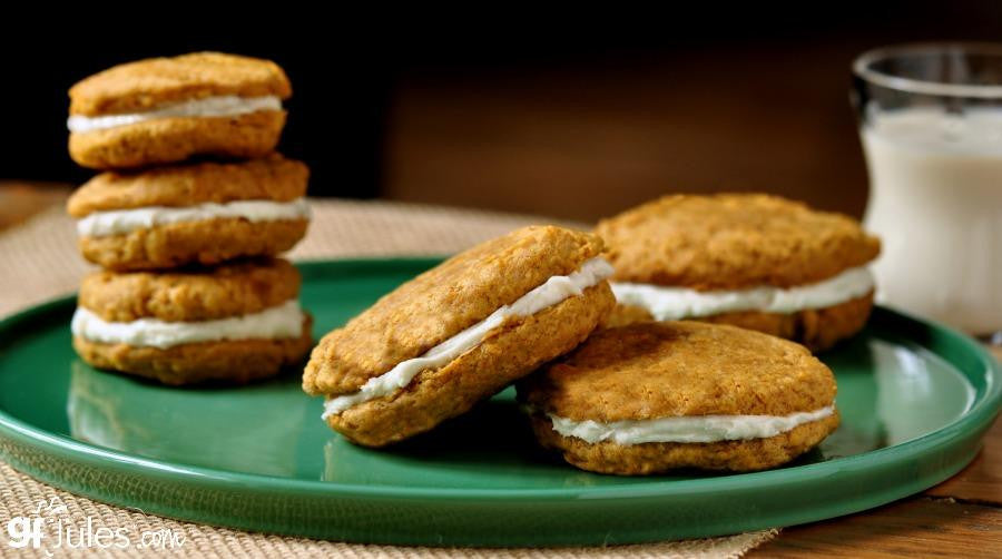 Gluten-free flour sugar cookies on a green plate with a glass of milk nearby