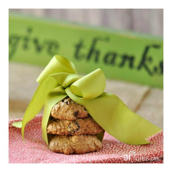 Gluten free cookies stacked with a neon green ribbon
