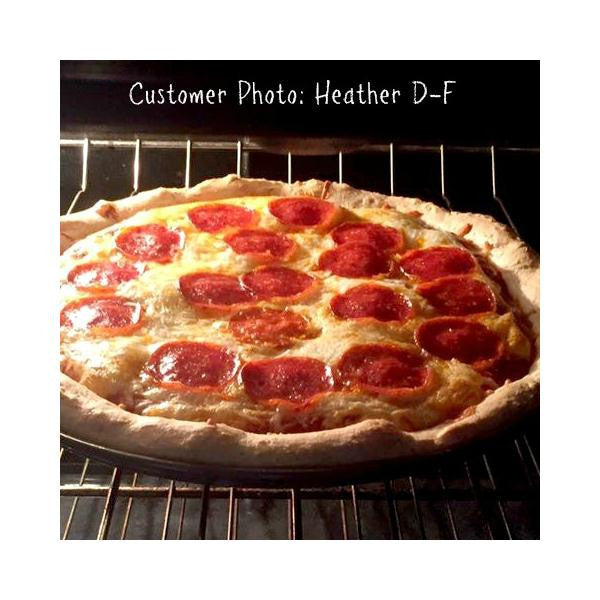 Gluten-free pizza crust topped with pepperoni and tomato sauce