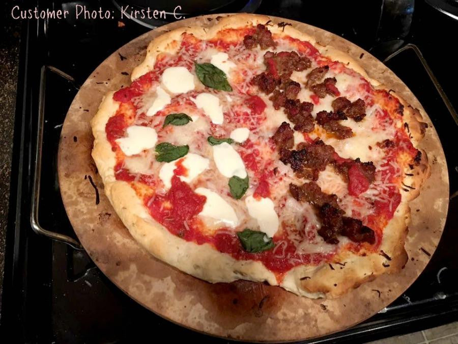 Gluten-free pizza crust pizza with pepperoni, white cheese, and basil