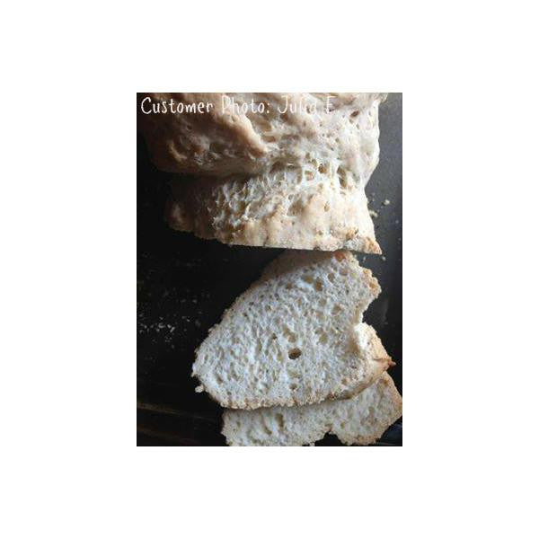 Gluten-free pizza crust slices stacked with airy, speckled crumb