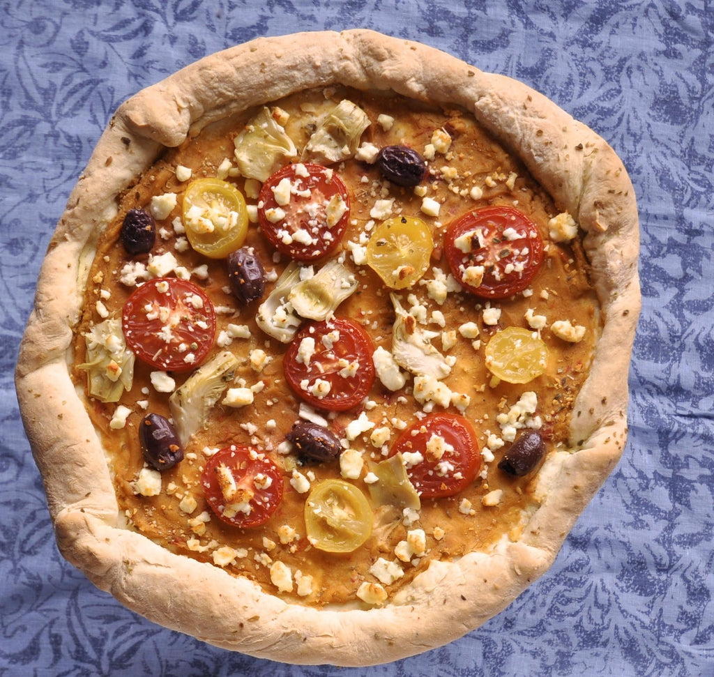 Whole gluten-free pizza with pepperoni, olives, mushrooms, and cheese