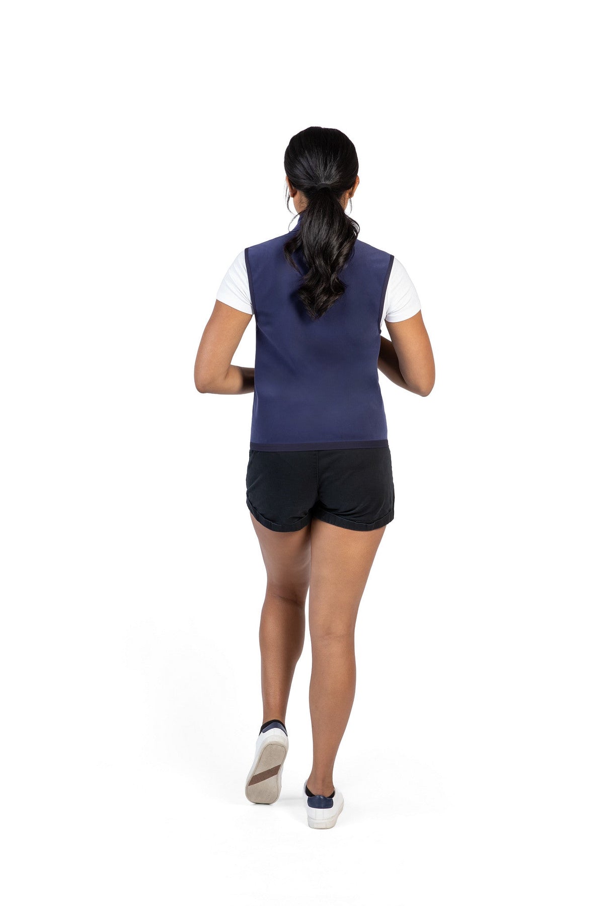 Men's dark blue cooling vest worn facing away, back view with stand collar and zip