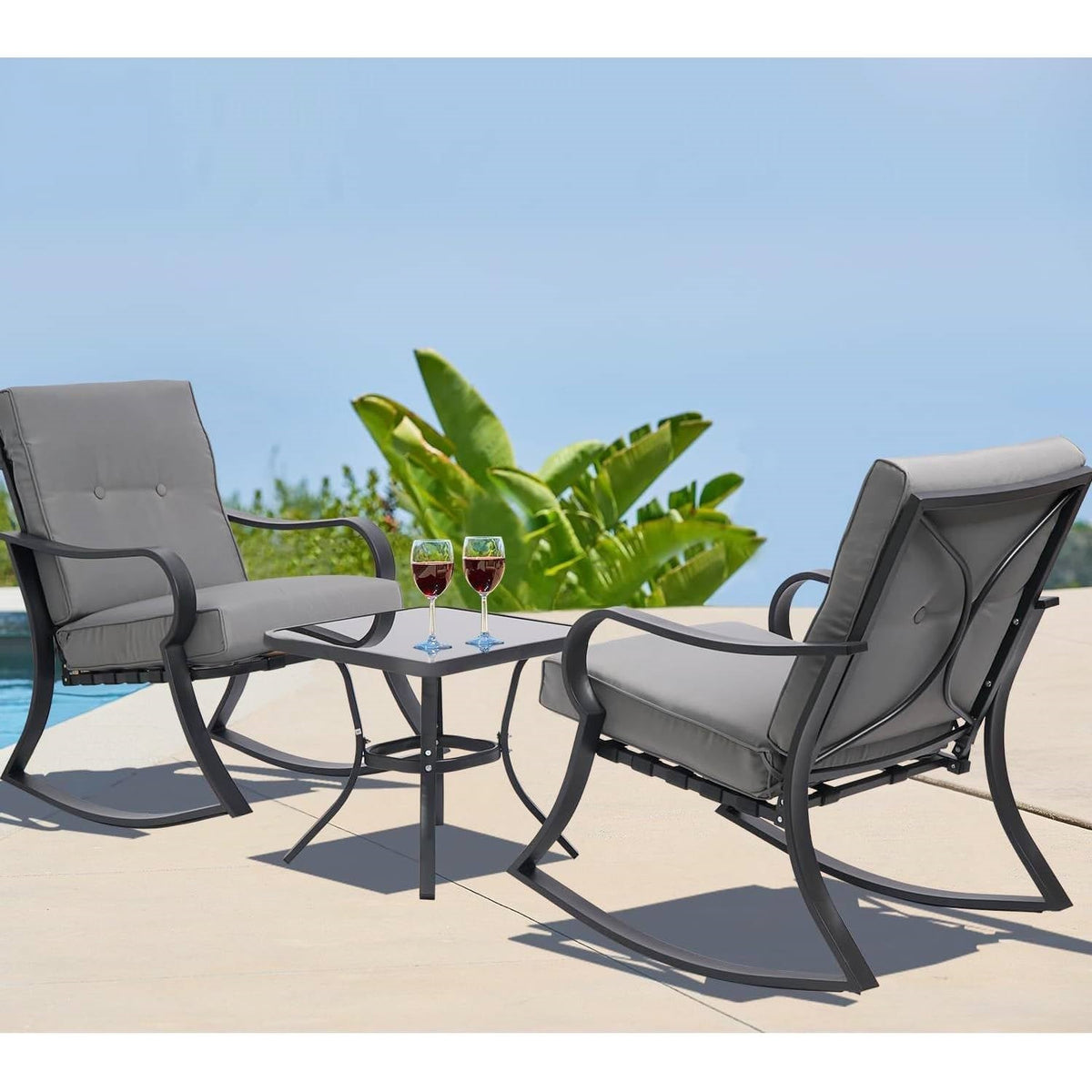 Patio rocking chair set with two grey-cushioned chairs and a black square table