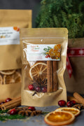 Stovetop potpourri mix pouch with dried orange slices, cinnamon sticks, and berries