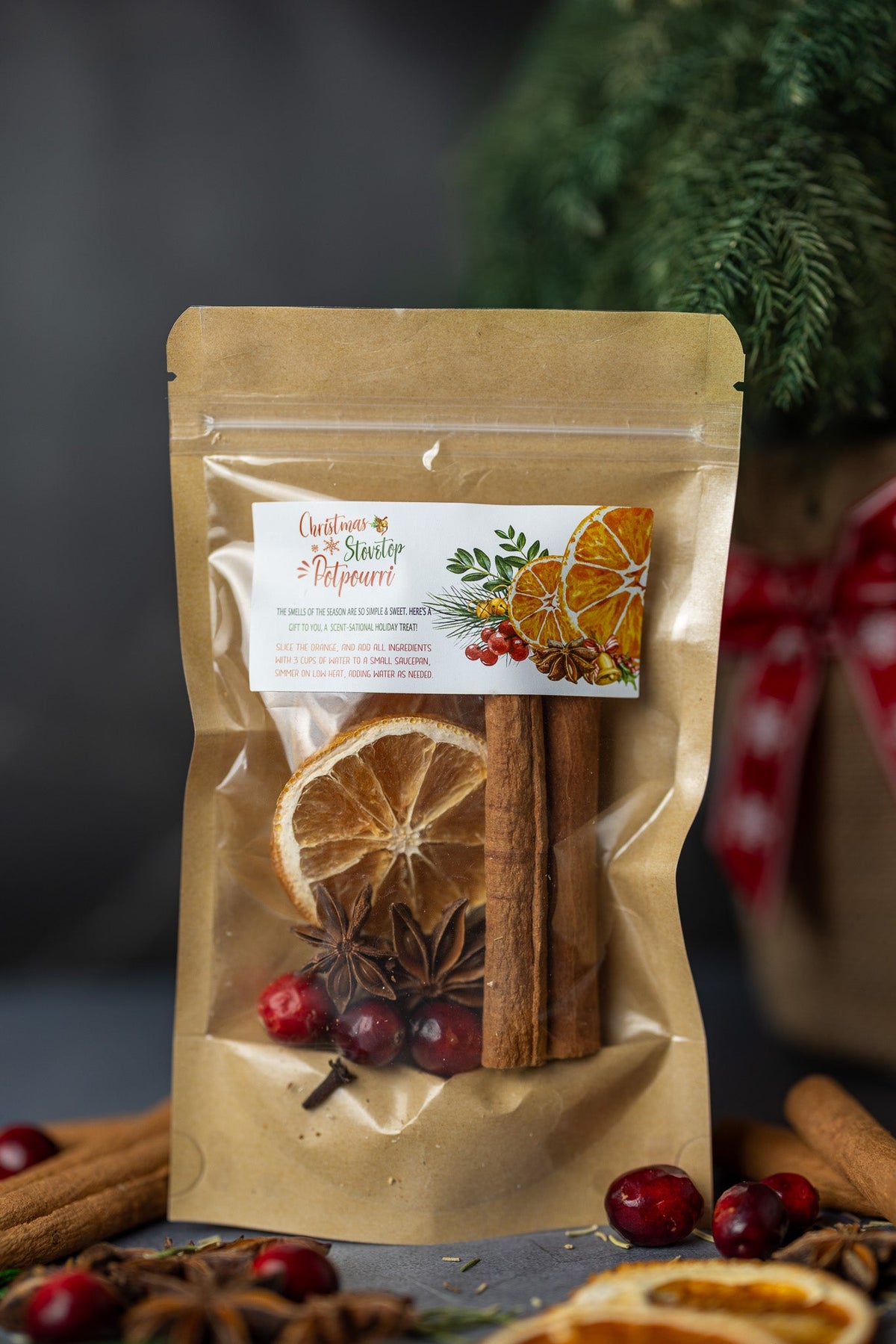 Stovetop potpourri pouch with cinnamon sticks, dried orange, and star anise
