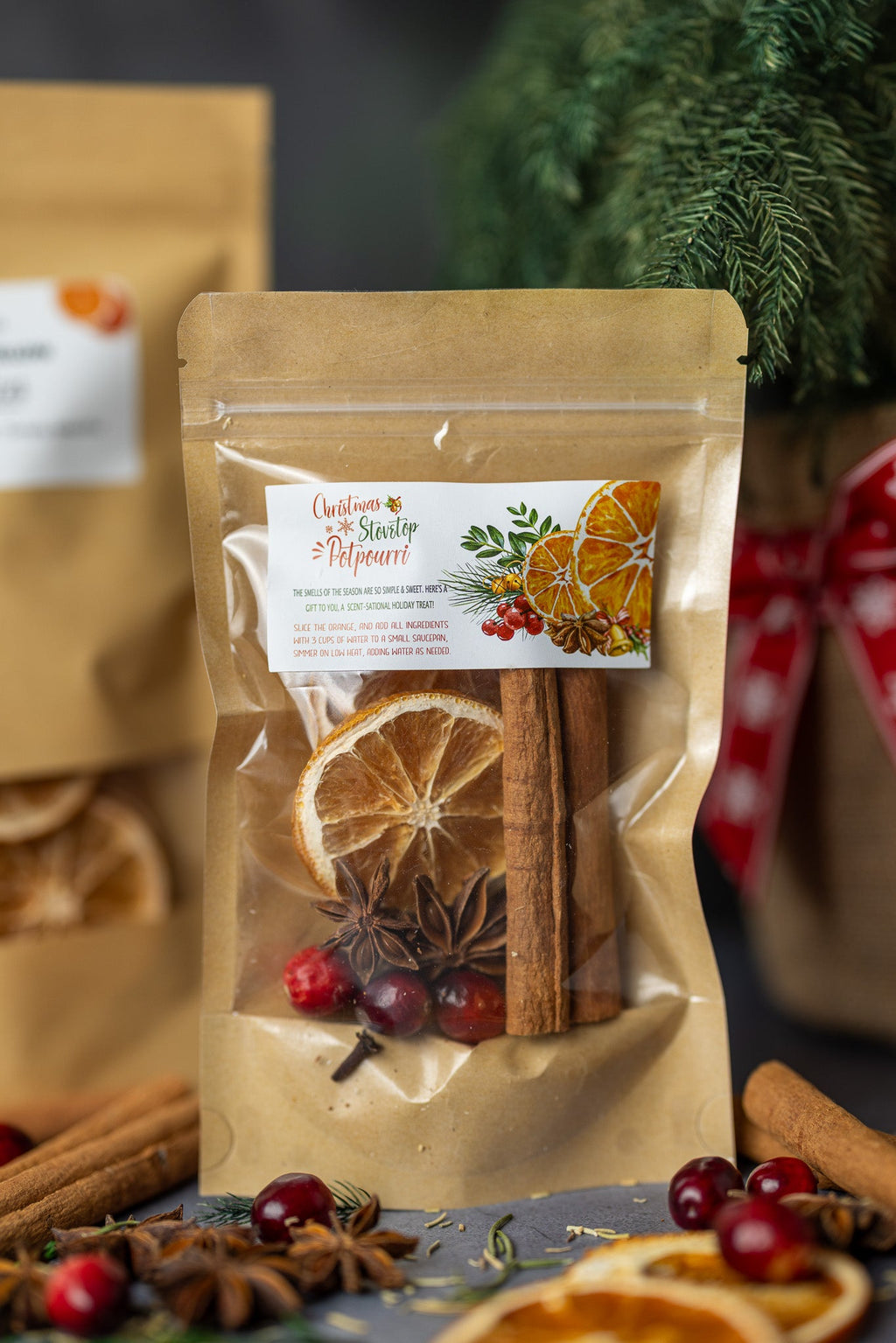 Stovetop potpourri pouch with orange rounds, cinnamon sticks, and whole spices