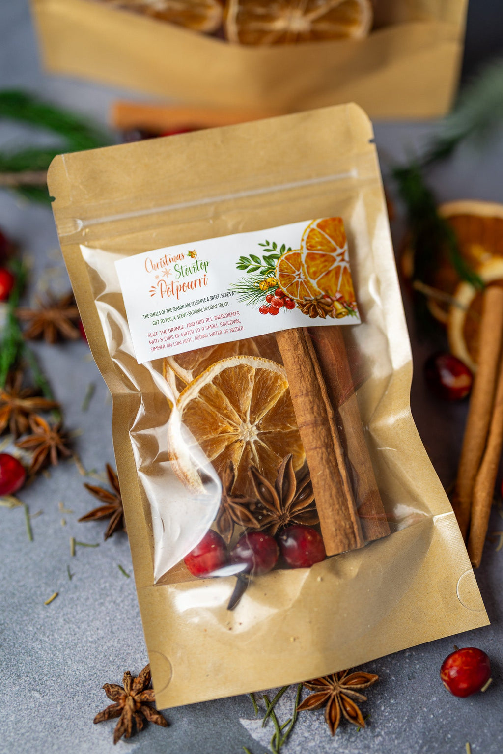 Stovetop potpourri pouch with orange slices, cinnamon sticks, and dried cranberries