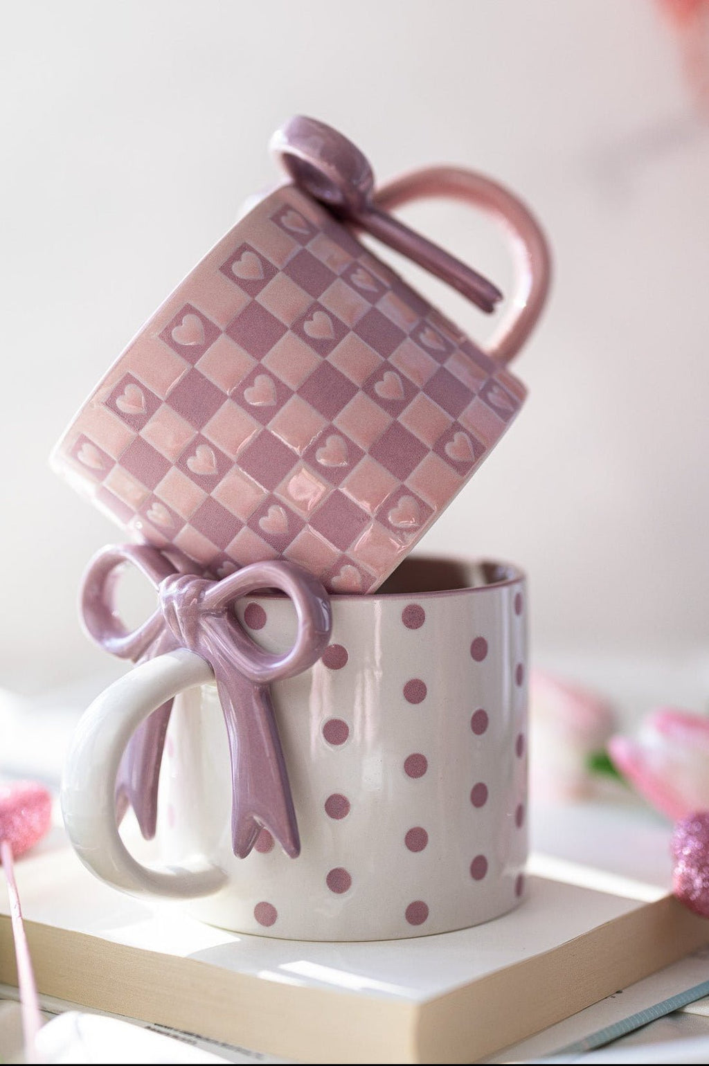 Ceramic mug in light purple with dot pattern and bowknot ribbon detail on top