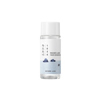 Small clear toner bottle with white cap from Round Lab travel skincare set