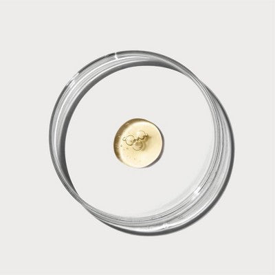 Naturium serum bottle with circular open cap, clear rim and inner gold dropper