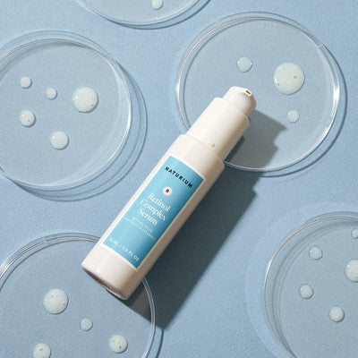 Naturium retinol complex serum bottle with pump, label facing up
