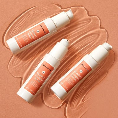 Set of Naturium Vitamin C Complex Serum bottles with white caps and coral label