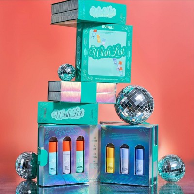 Skincare mini gift set with stacked boxes and six mini bottles, pastel caps