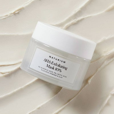 Naturium AHA Exfoliating Mask jar with white lid and front label, angled view