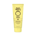 Yellow sunscreen tube labeled Kids SPF 50, clear sunscreen lotion with pump-top cap