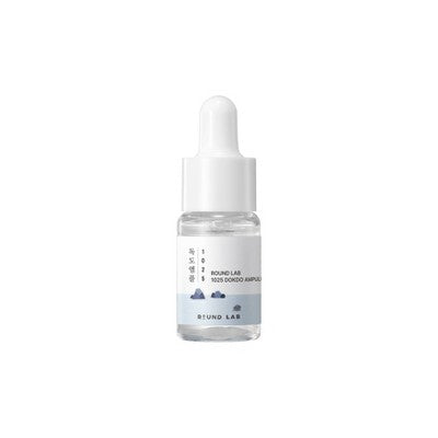 White dropper serum bottle from Round Lab skincare travel set