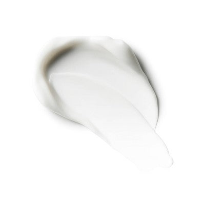 White body lotion cream swatch on skin-colored surface