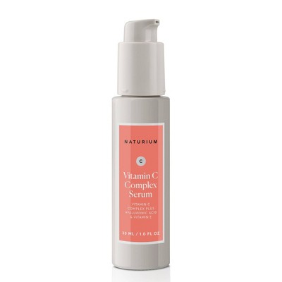 Naturium Vitamin C Complex Serum pump bottle in white and gray with coral front label
