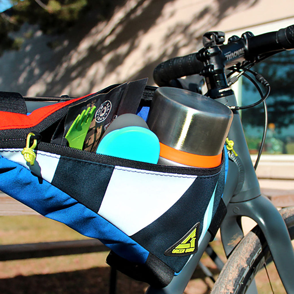 Blue and white striped bike frame bag with zip pocket and Green Guru logo patch