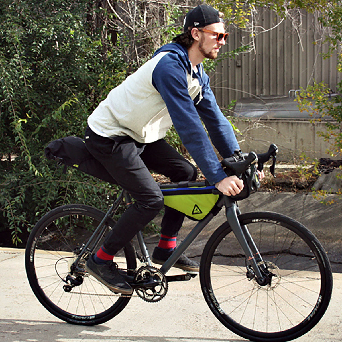 Large green and black bike frame bag with zipper and Green Guru logo patch