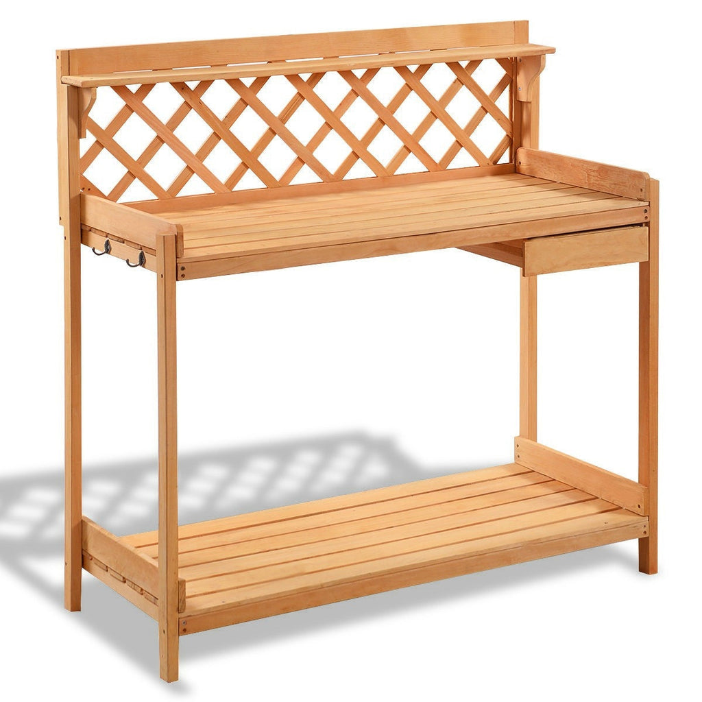 Wooden potting bench with slatted work top, open lower shelf, and storage drawer