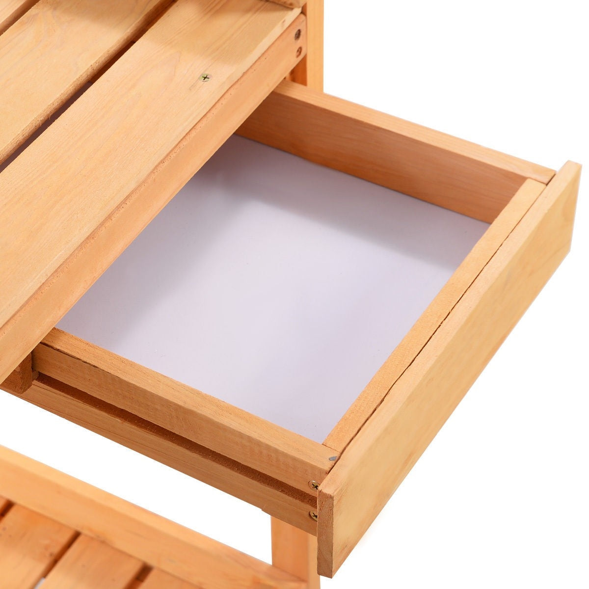 Wooden storage drawer tray of a potting bench with smooth slats and corner rails
