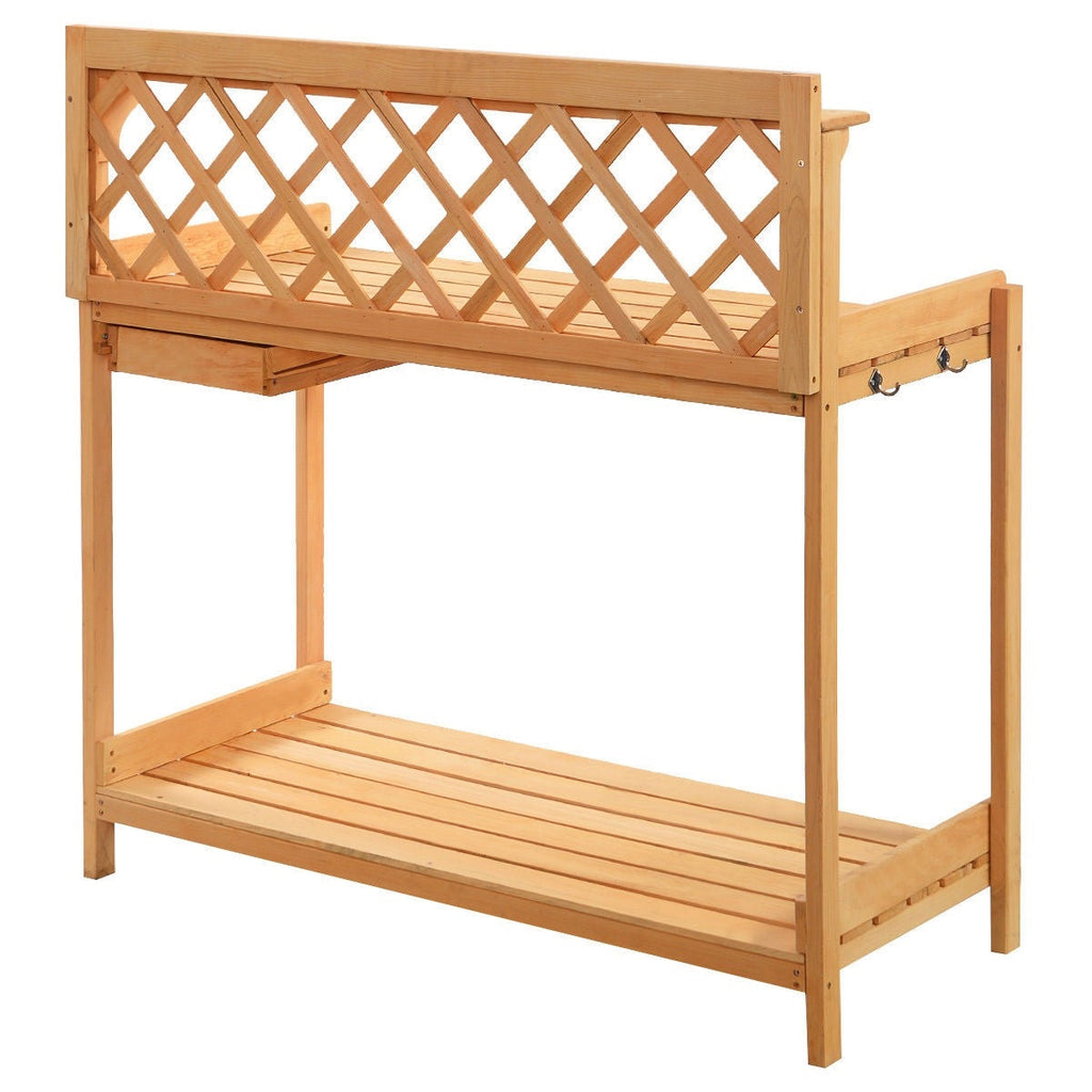 Wooden potting bench with lattice back panel and lower shelf for garden tools