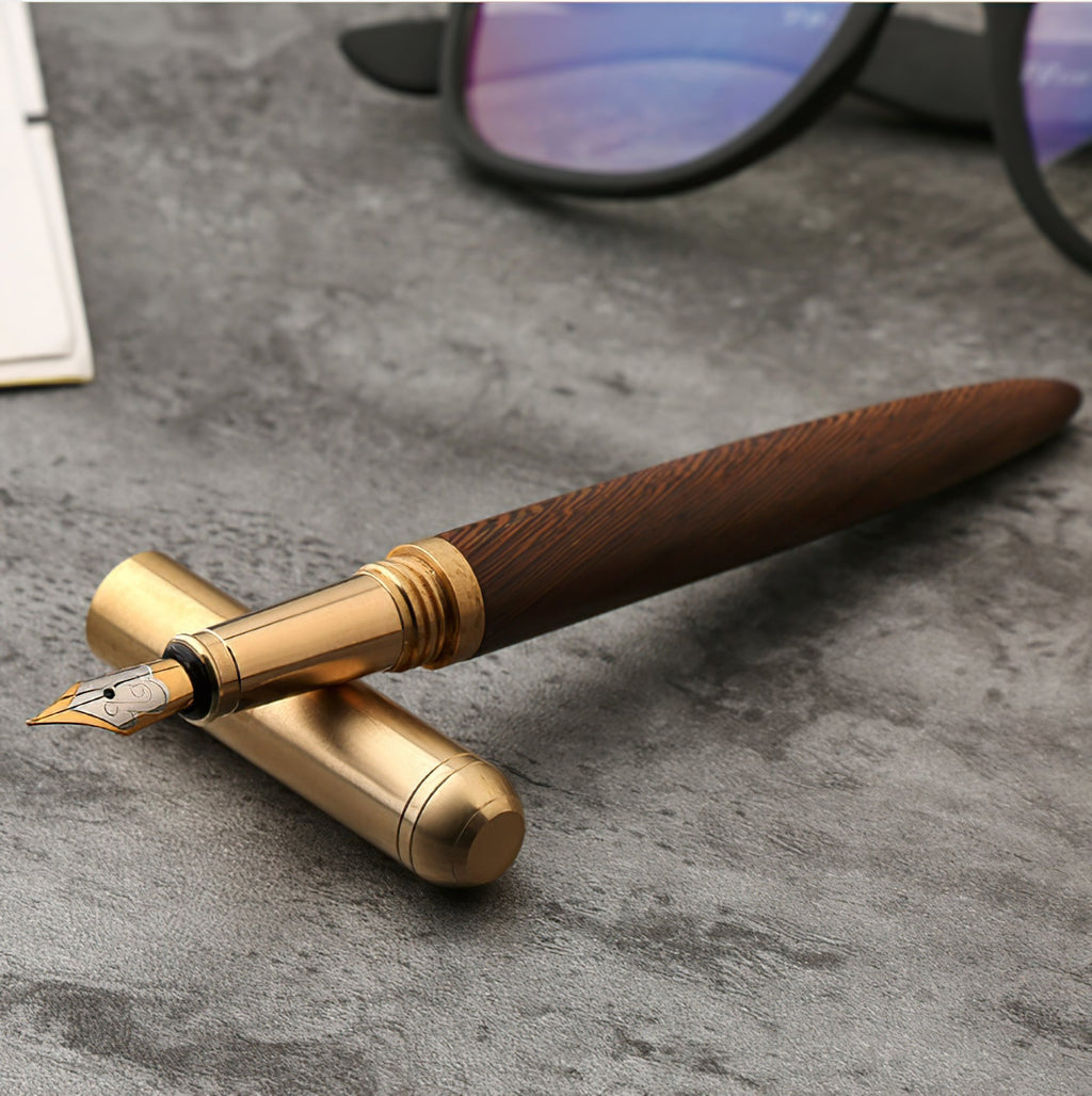 Handmade wood and brass fountain pen with gold-toned cap and nib