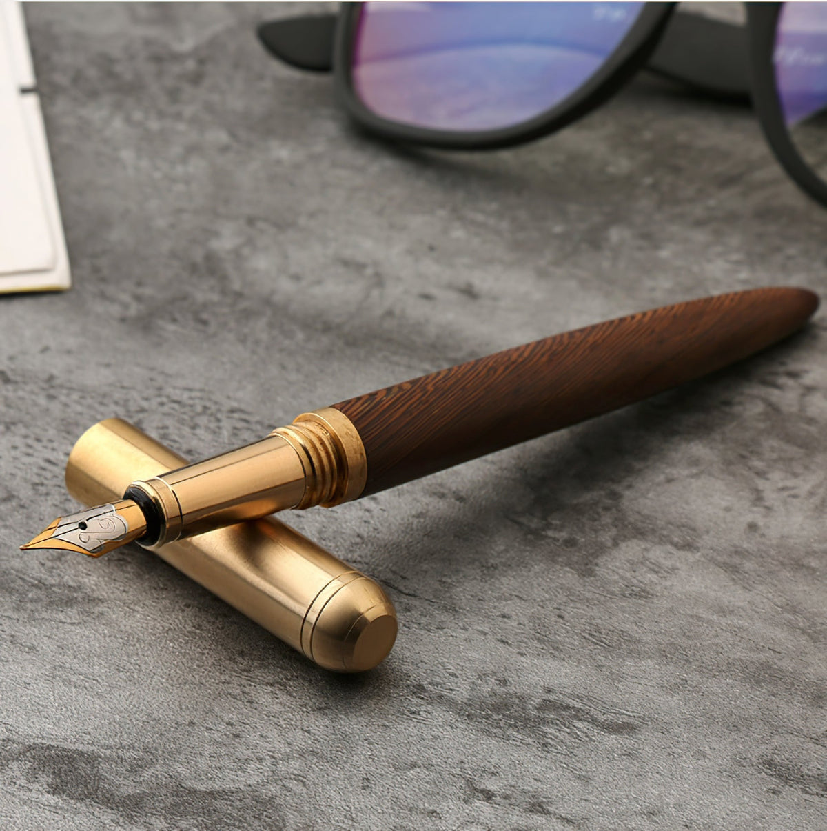Handmade wood and brass fountain pen with gold-toned cap and nib