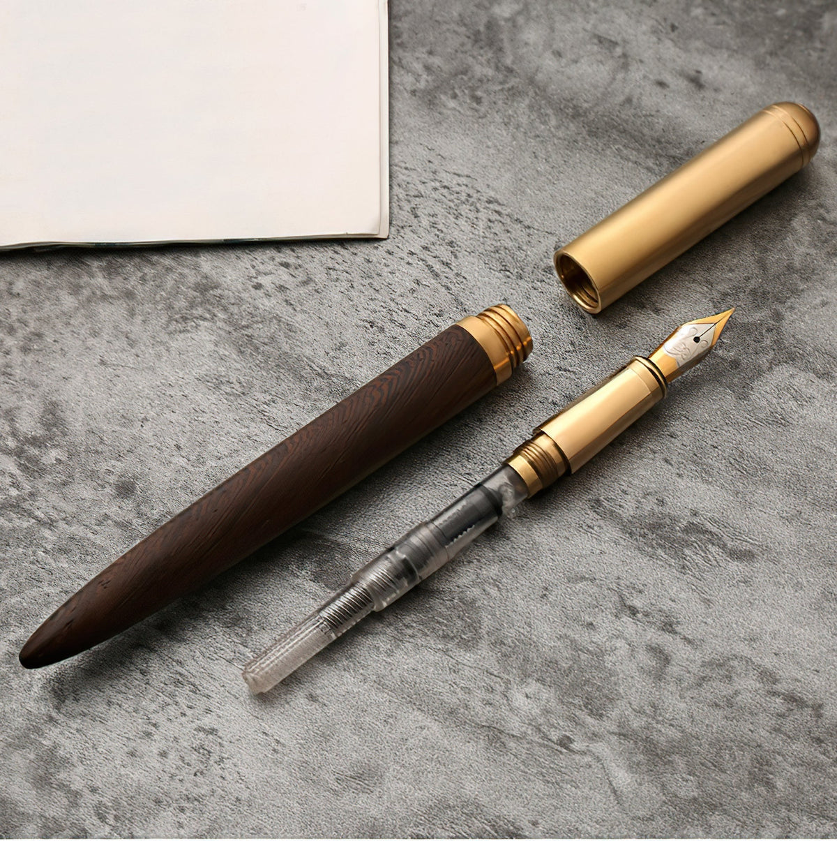 Handmade fountain pen pair with wood barrels and gold-toned caps