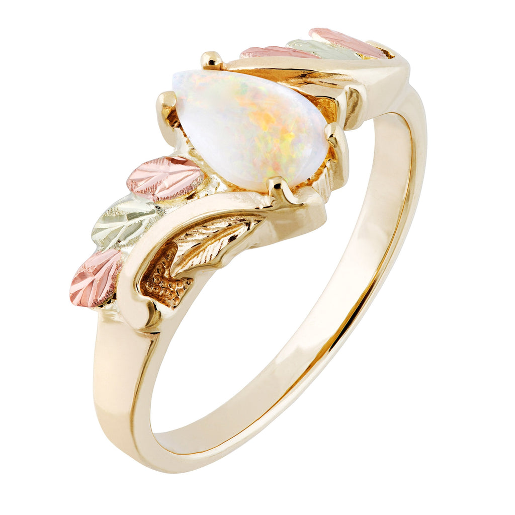 Gold-tone ring with oval opal-like stone and pink/green floral leaf accents