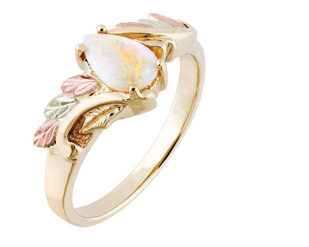 Gold-tone ring with oval opal-like stone and leaf-and-flower enamel accents