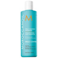 Moroccanoil Frizz Control shampoo bottle, turquoise with white cap and label