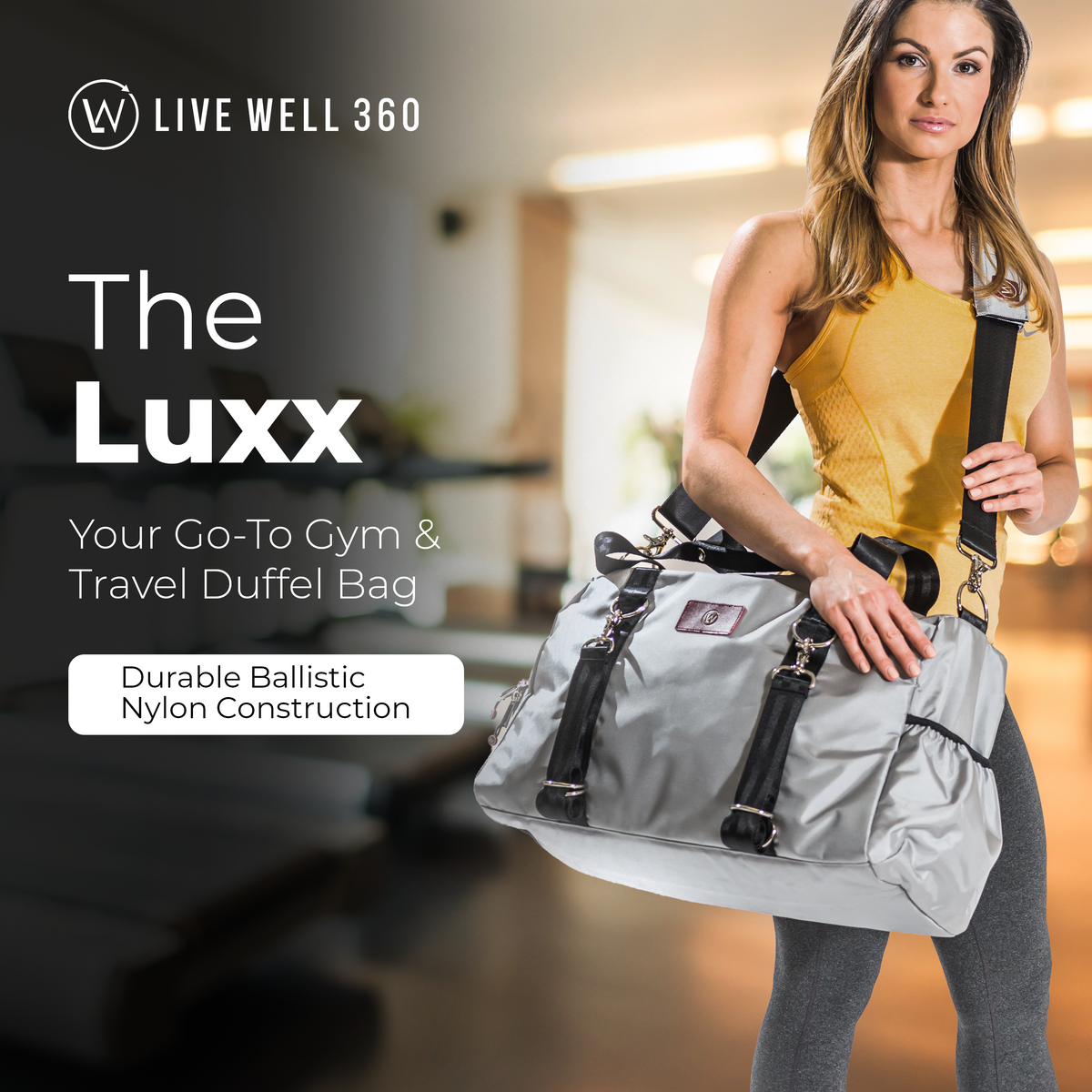 Light gray duffel bag with black handles, red logo patch, and detachable front pouch