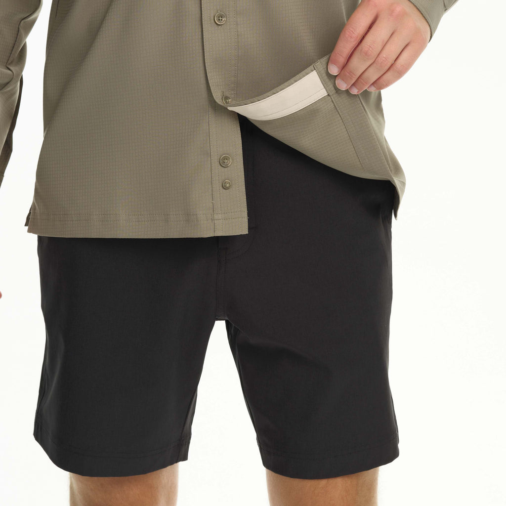 Sage scout shirt close-up: front buttons, placket, and curved hem