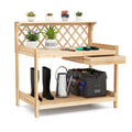 Wooden garden potting bench with lattice trellis, tool storage shelves, watering can