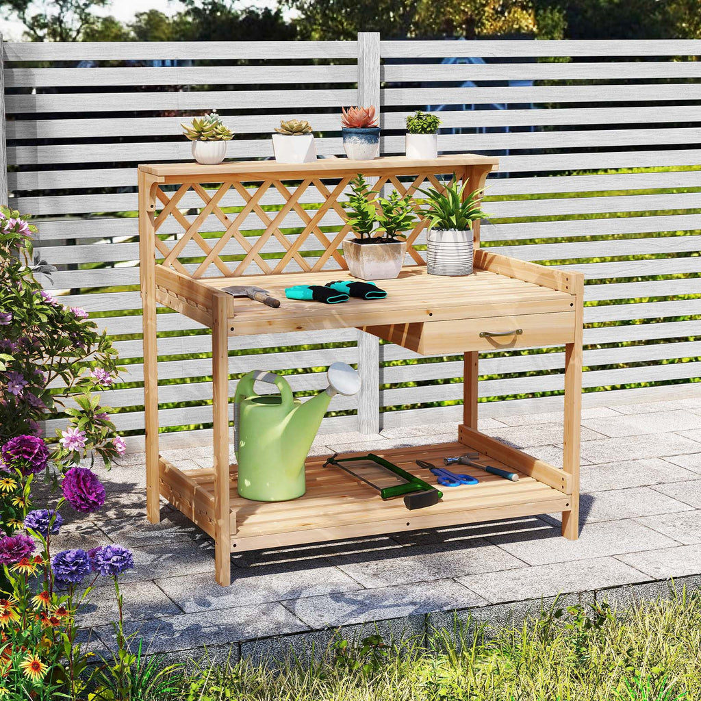Wooden garden potting bench with lattice trellis, two-tier shelves, potted plants