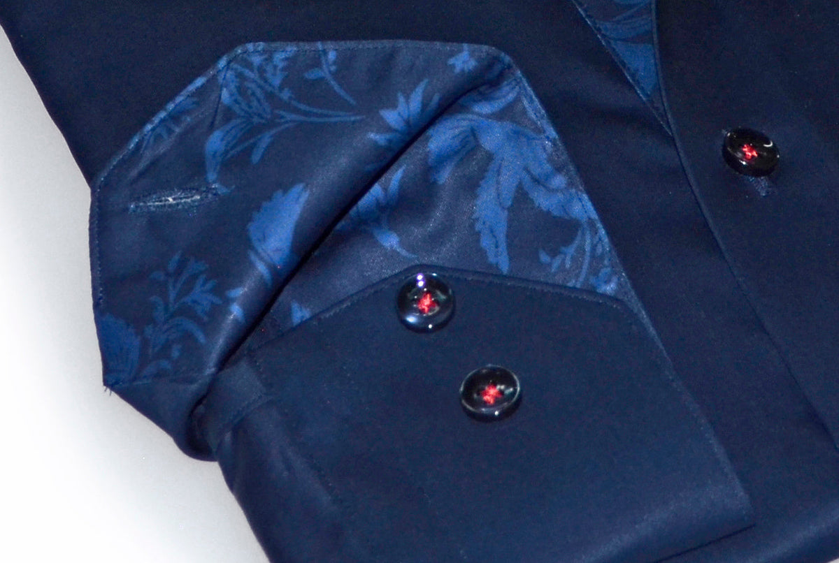 Close-up of navy button placket with blue patterned contrast lining and dark buttons