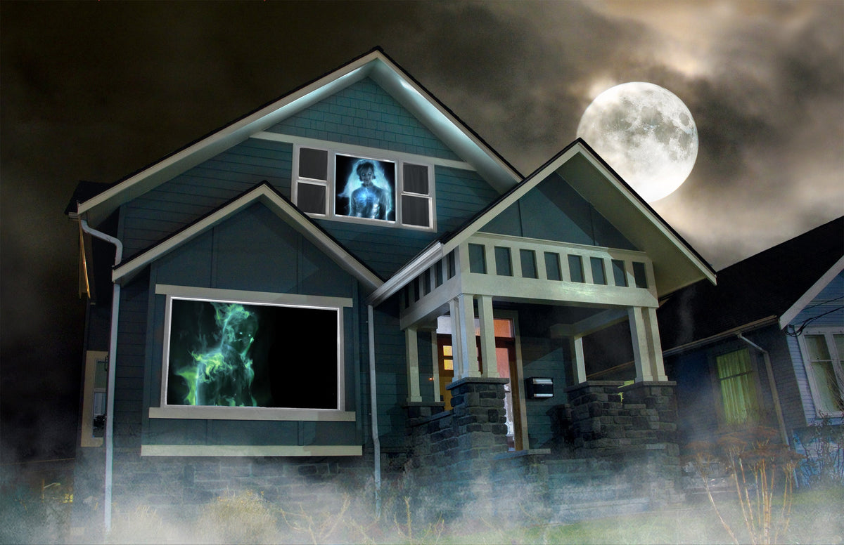 Outdoor house projection showing a glowing blue ghost figure under a full moon