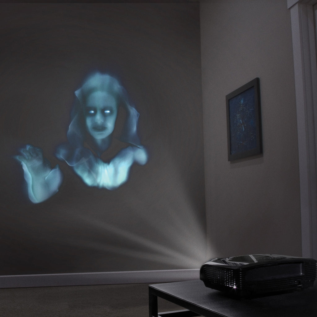 Blue ghost apparition projected on a wall with a black projector on the floor